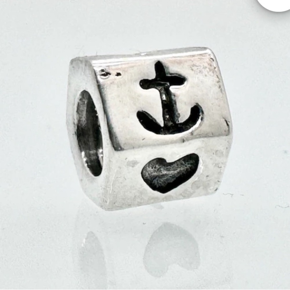 Authentic retired sterling silver heart and anchor pandora charm.
